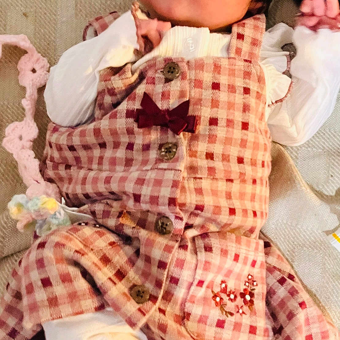 Lydia Amayra joined the competition — help win amazing prizes! baby, infant, child, portrait, lying_down, checkered_outfit, pink_clothing, white_sleeves, bow, frills, blanket, bedding, toy, stuffed_toy, indoor, cozy, face, eyes_open, fashion, photography