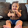 baby, infant, smiling, leopard_print, headband, shorts, sandal, couch, indoor, child, cute, happy, feet, hands, sitting, portrait, window_blinds, home, comfort, clothing