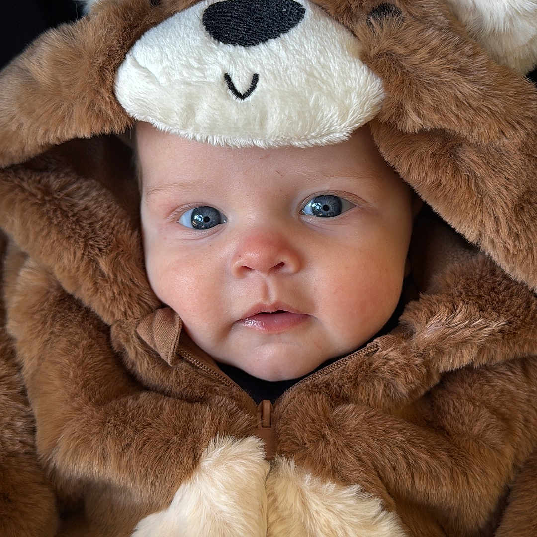Freddie joined the competition — help win amazing prizes! adorable, animal_outfit, baby, baby_fashion, blue_eyes, child, closeup, clothing, costume, cute, expression, face, fur, hood, infant, portrait, smile, soft, warm, young