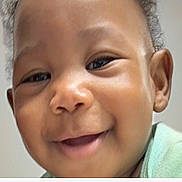 Khaleesi is registered to the contest to win money with this photo: baby, child, infant, portrait, close_up, smiling, happy, face, eyes, nose, mouth, hair, indoor, home, mint_green, clothing, natural_light, closeup_photography, adorable, person