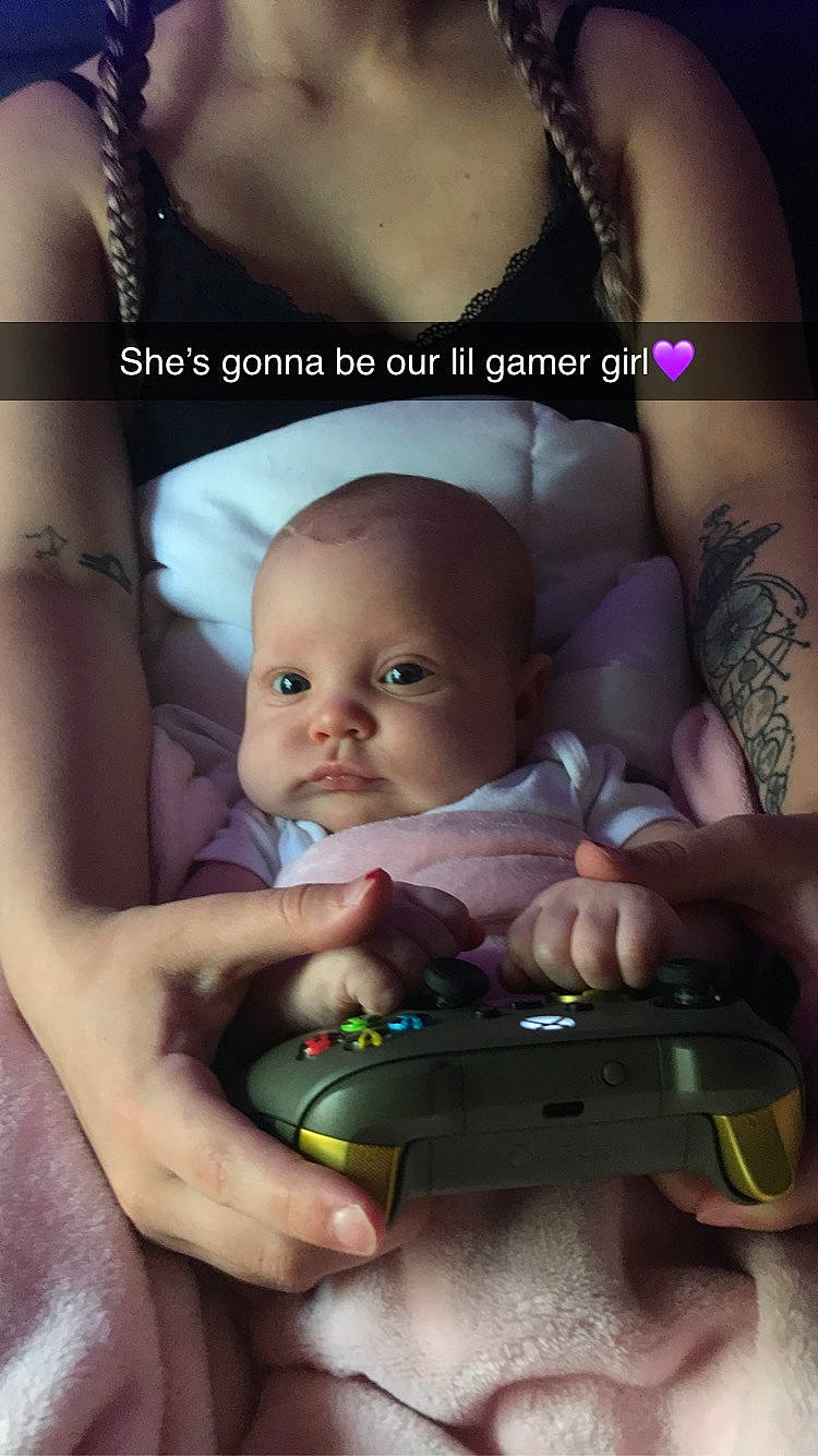 Dahlia is registered to the contest to win money with this photo: baby, black_hair, cheek, chest, child, eyebrow, eyelash, facial_expression, flash_photography, gadget, gesture, hand, happy, iris, mouth, muscle, nail, nose, person, thumb