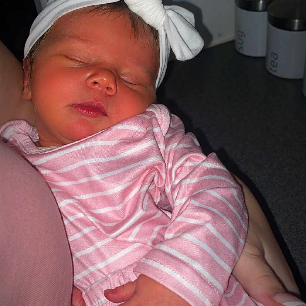 Lyla-Ann joined the competition — help win amazing prizes! arm, baby, bow, closeup, container, countertop, cute, hand, headband, indoor, infant, kitchen, newborn, peaceful, person, pink_clothing, portrait, sleeping, soft_lighting, striped_clothing