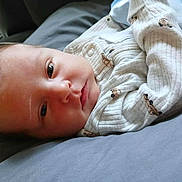 Easton joined the competition — help win amazing prizes! baby, newborn, infant, sleeping, resting, onesie, clothing, blanket, face, head, cute, soft, comfort, indoors, person, child, skin, expression, young, lying_down