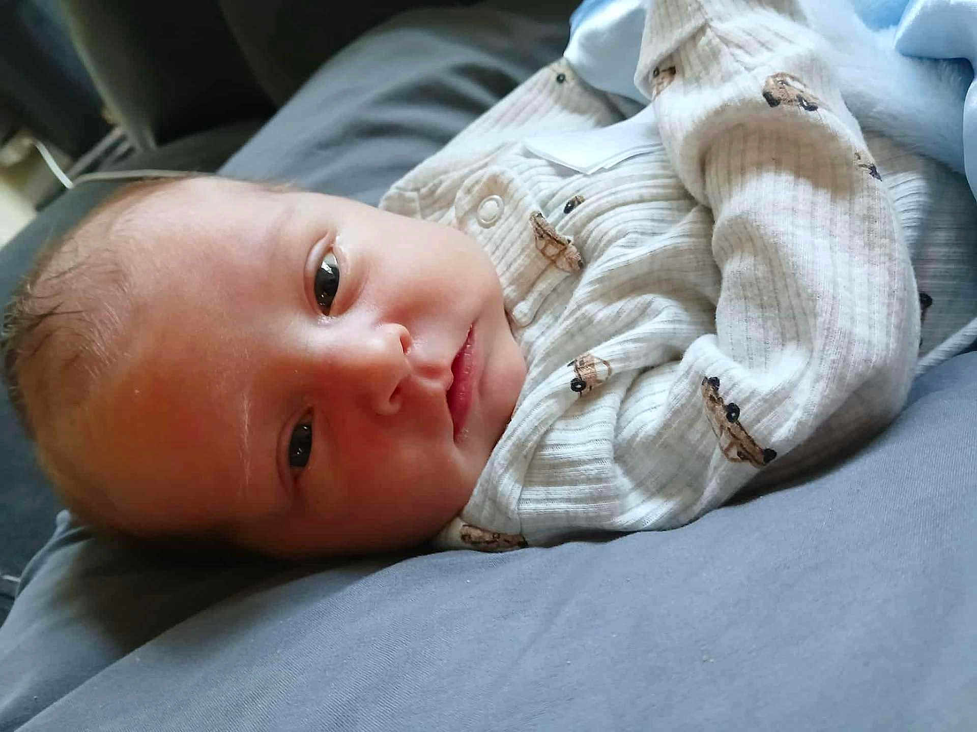 Easton joined the competition — help win amazing prizes! baby, newborn, infant, sleeping, resting, onesie, clothing, blanket, face, head, cute, soft, comfort, indoors, person, child, skin, expression, young, lying_down