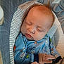Easton joined the competition — help win amazing prizes! baby, baby_seat, blanket, blue_clothing, child, closeup, cozy, cute, face, hand, indoor, infant, newborn, onesie, peaceful, portrait, resting, sleeping, soft, striped
