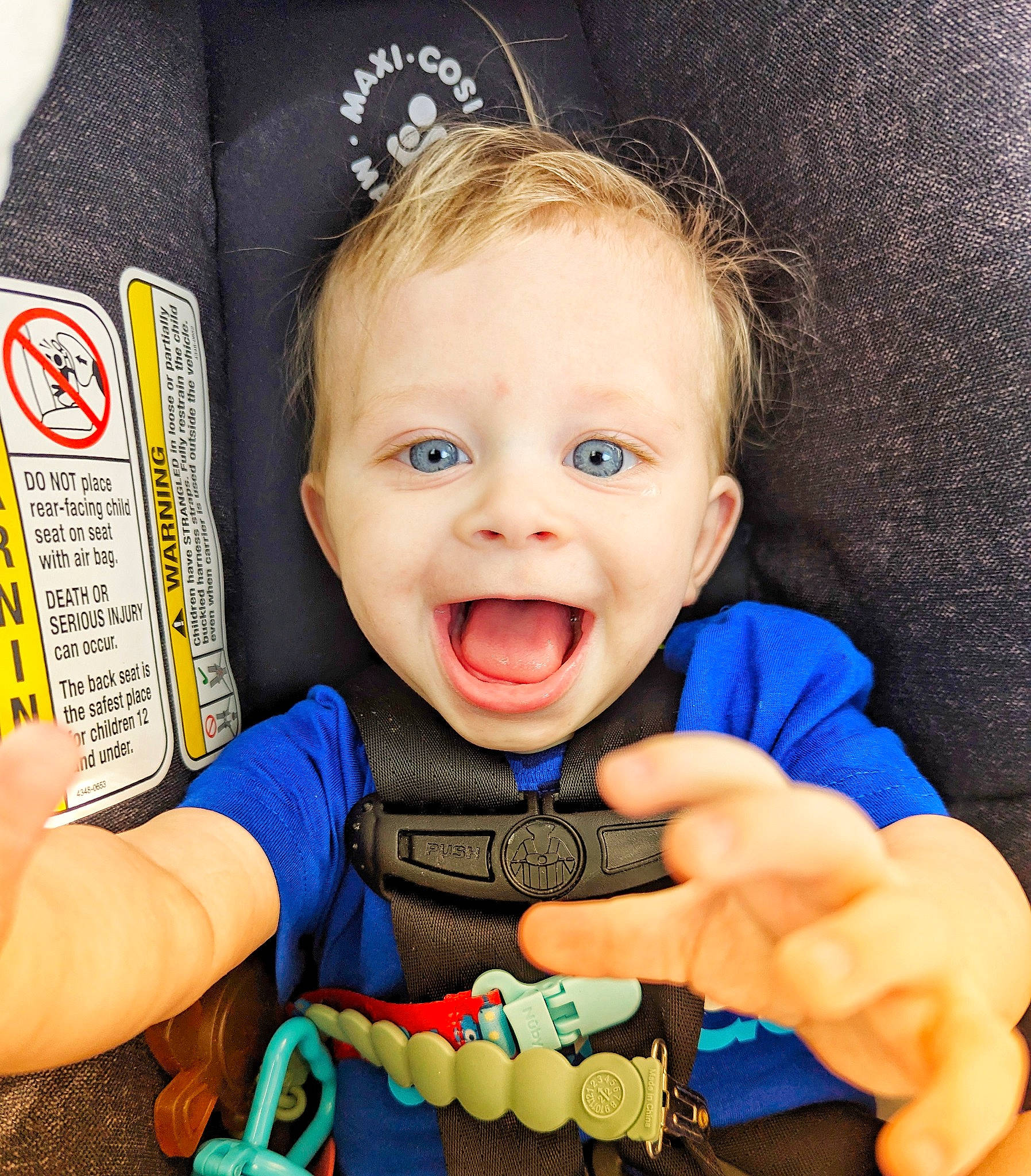 Malcolm is registered to the contest to win money with this photo: arm, baby, baby_toddler_clothing, cheek, child, cool, eye, facial_expression, finger, gesture, hand, happy, mouth, nail, nose, organ, person, product, smile, thumb