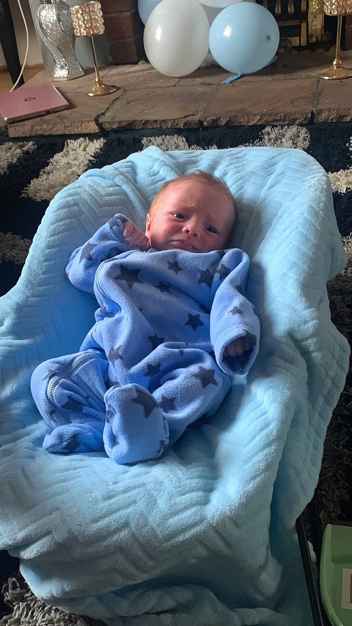 Brodie is registered to the contest to win money with this photo: baby, baby_products, baby_safety, baby_toddler_clothing, bedtime, cheek, child, comfort, face, head, linens, person, purple, room, sitting, skin, toddler