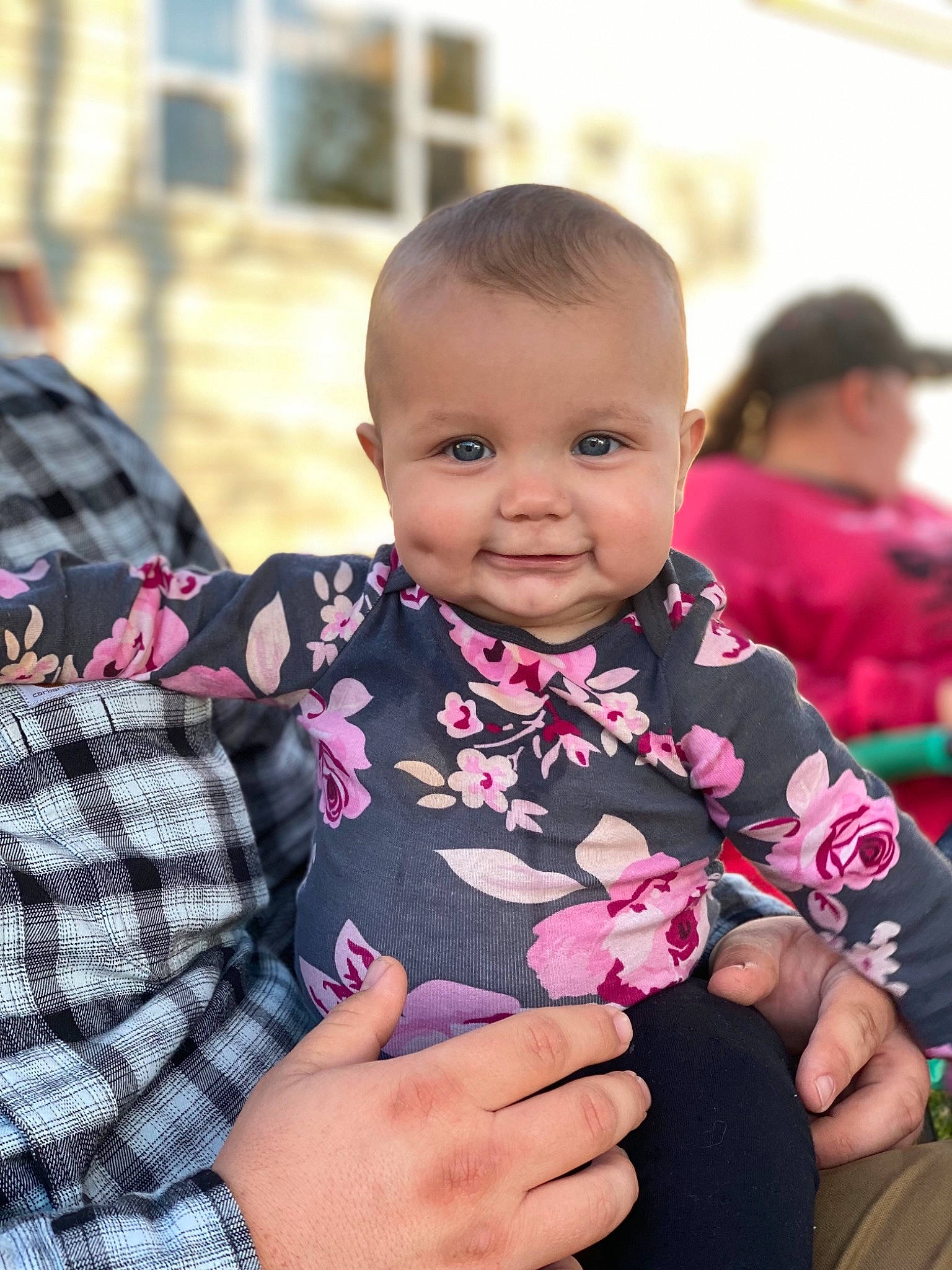 Emberleigh joined the competition — help win amazing prizes! baby, baby_toddler_clothing, cheek, child, event, gesture, happy, human, joy, magenta, pattern, person, pink, plaid, purple, sitting, skin, sleeve, smile, tartan