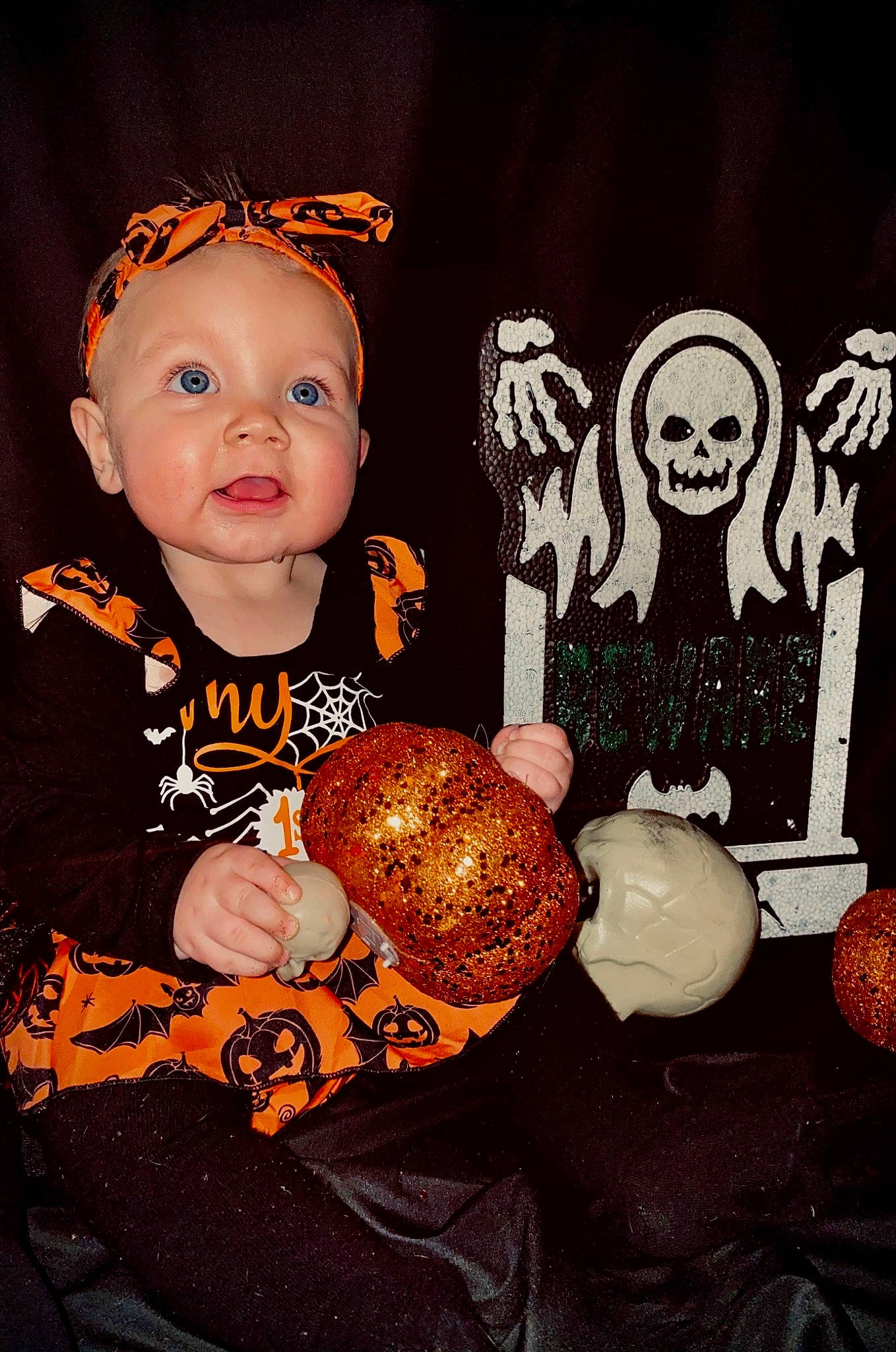 Emberleigh is registered to the contest to win money with this photo: baby, baby_toddler_clothing, baking, brown, child, event, fashion_accessory, jewellery, mammal, orange, person, product, room, sitting, sleeve, surprise, sweetness, t_shirt, teddy_bear, textile