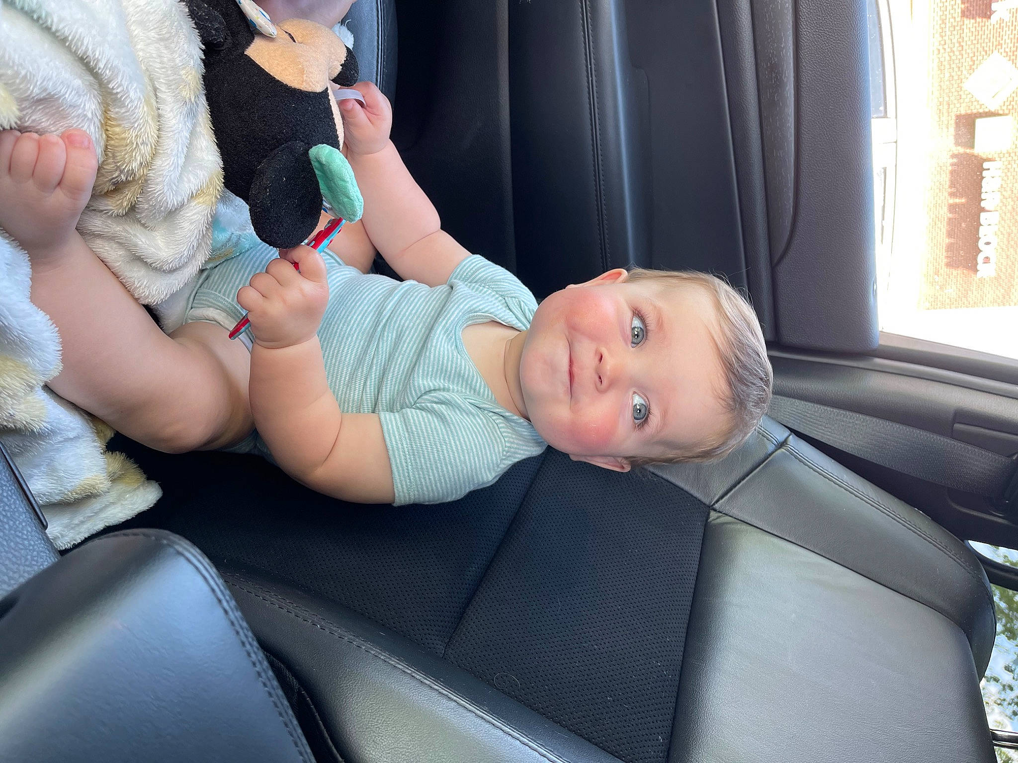 Finnley is registered to the contest to win money with this photo: arm, automotive_design, baby, baby_products, baby_toddler_clothing, car, car_seat, child, comfort, curtain, finger, hat, motor_vehicle, person, personal_luxury_car, skin, thigh, toddler, vehicle, vehicle_door