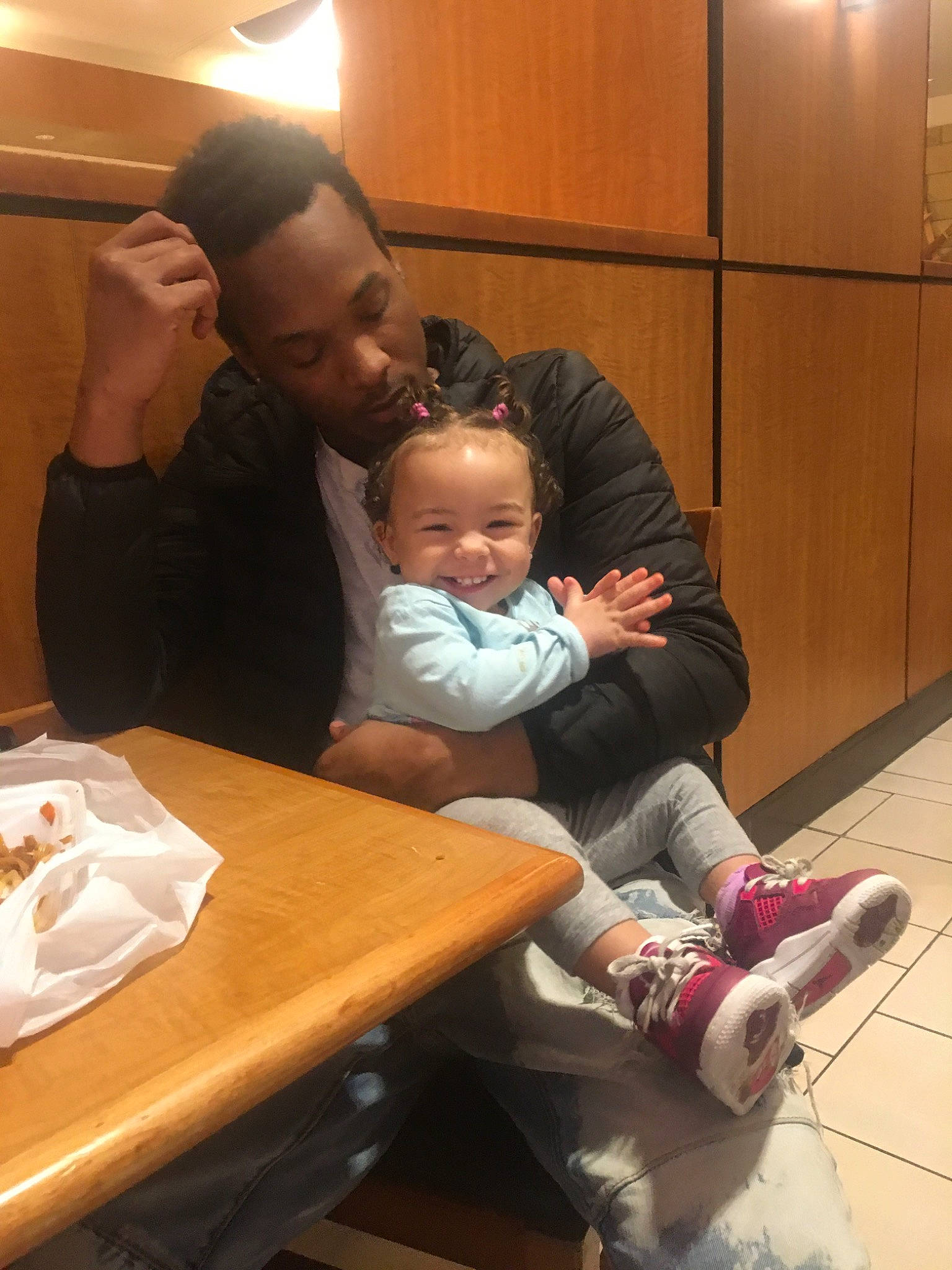 Tori joined the competition — help win amazing prizes! baby, chair, child, comfort, conversation, desk, event, fun, happy, interaction, joy, kitchen_dining_room_table, lap, person, plate, room, sitting, smile, sock, table