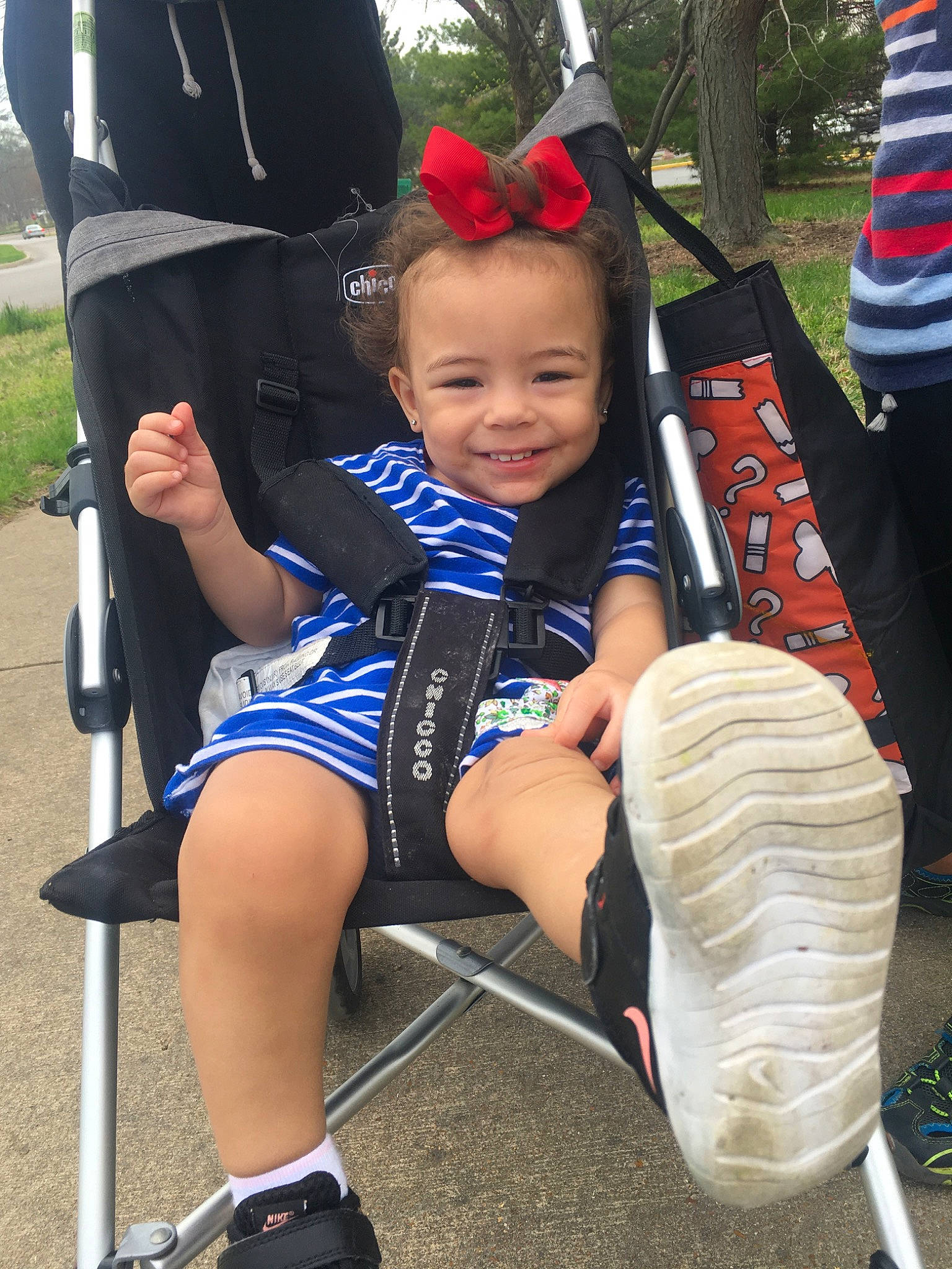 Tori is registered to the contest to win money with this photo: baby, baby_products, child, electric_blue, fun, goggles, hat, human_leg, joy, lap, leisure, person, personal_protective_equipment, recreation, shorts, sitting, smile, sneakers, thigh, toddler