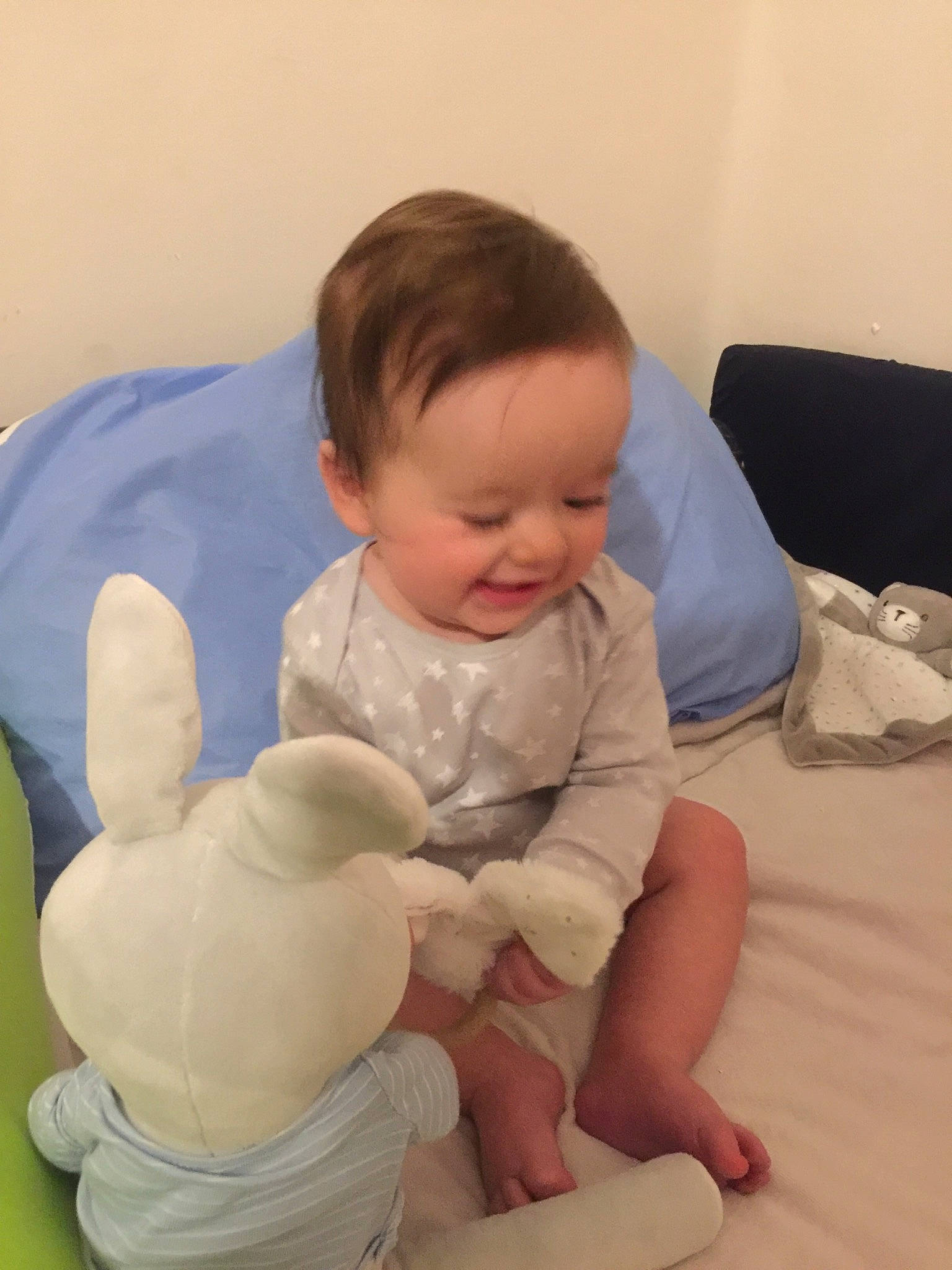 Ayrton participe au concours pour gagner de l'argent avec cette photo : ankle, baby, baby_grabbing_for_something, baby_products, baby_toddler_clothing, baby_toys, bag, barefoot, cheek, child, comfort, foot, person, plush, rabbit, skin, sock, stuffed_toy, toddler, toe