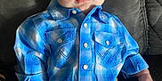 Lucas joined the competition — help win amazing prizes! baby, infant, blue_shirt, plaid, shorts, couch, gray, person, child, face, skin, hand, leg, seated, indoors, clothing, casual, young, expression, portrait