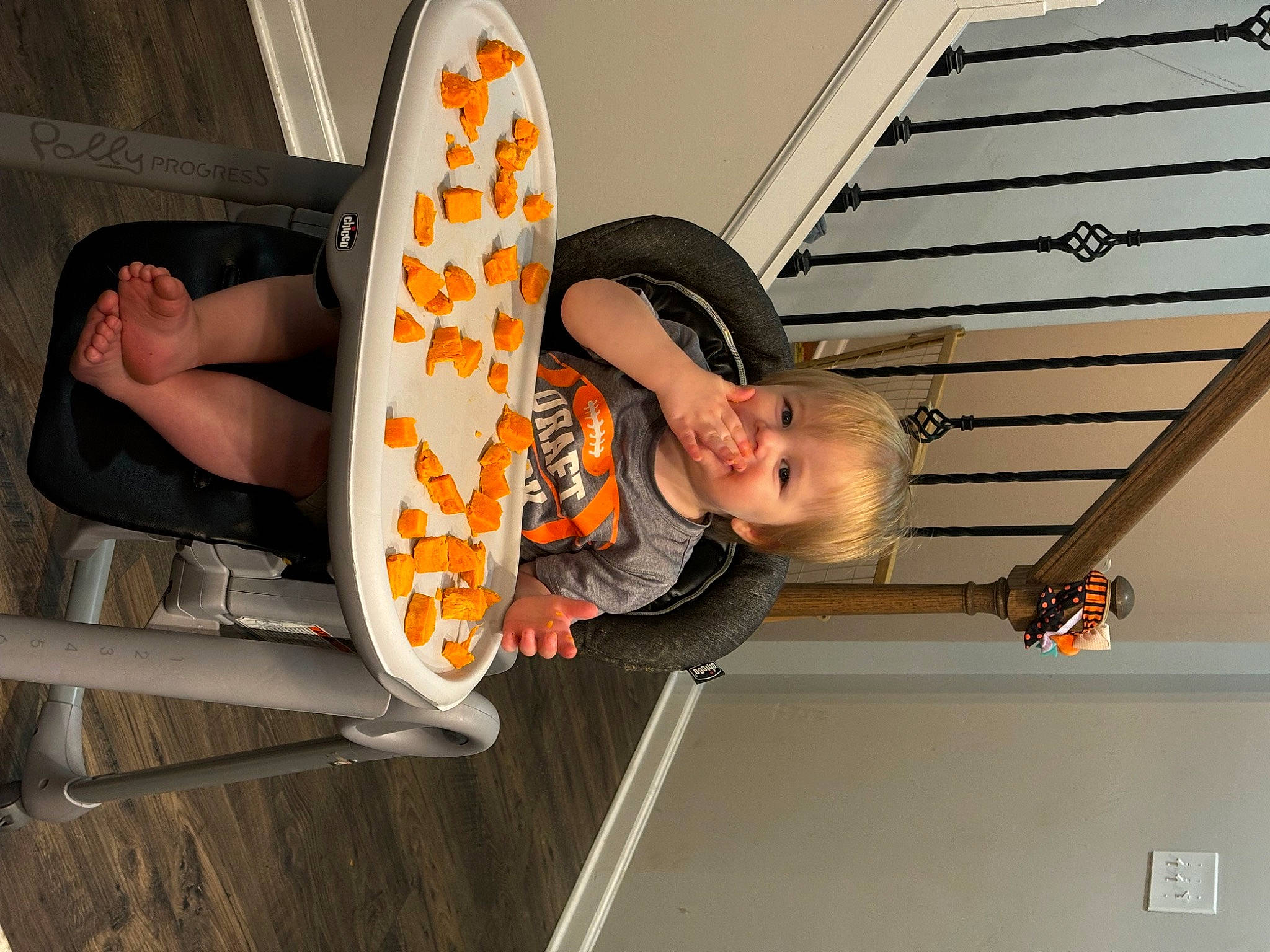 Cash joined the competition — help win amazing prizes! automotive_wheel_system, ceiling, chair, child, comfort, fun, hat, human_leg, leisure, orange, person, personal_protective_equipment, smile, thigh, toddler, wood