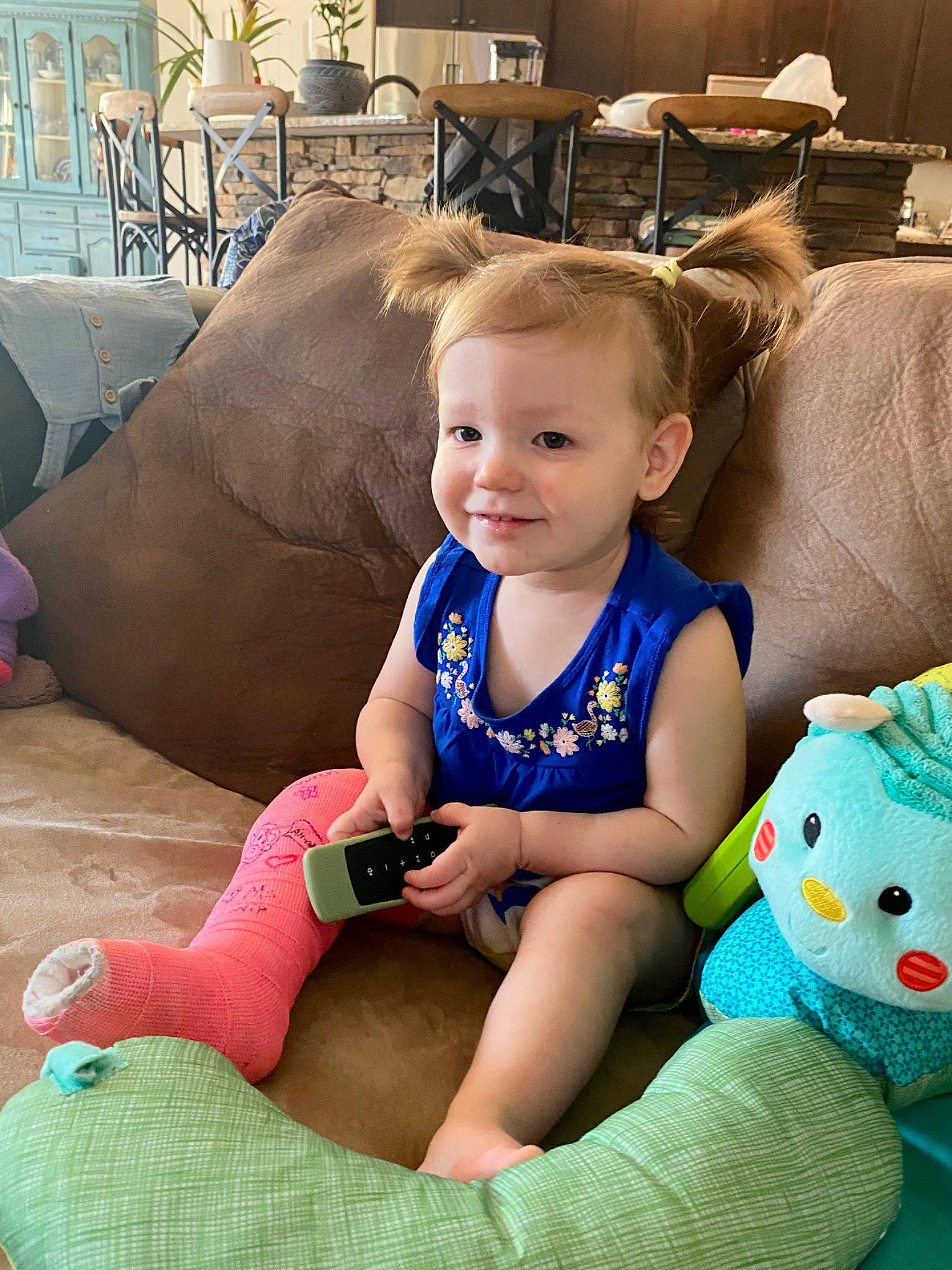 Millie is registered to the contest to win money with this photo: baby_toddler_clothing, blue, child, comfort, face, facial_expression, fun, happy, head, human_body, joy, lap, leisure, mouth, organ, person, product, skin, smile, summer