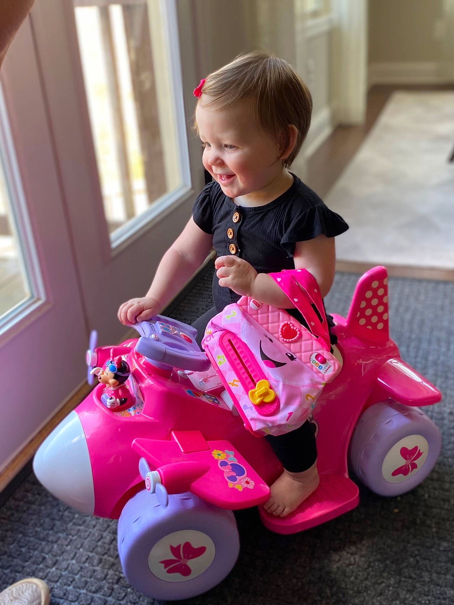 Millie joined the competition — help win amazing prizes! baby, baby_playing_with_toys, baby_toddler_clothing, child, facial_expression, fun, happy, magenta, person, pink, product, riding_toy, smile, snapshot, tire, toddler, toy, toy_vehicle, vehicle, wheel