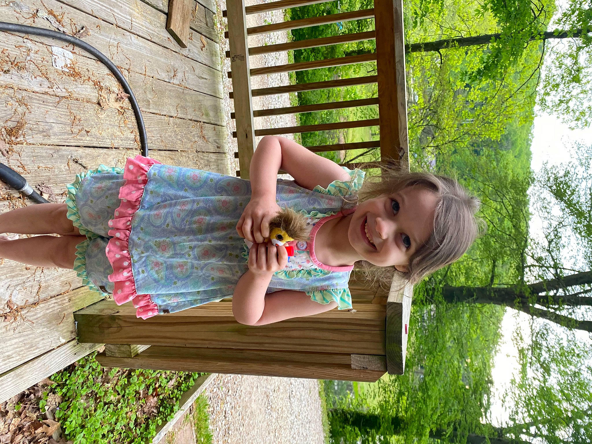 Victoria joined the competition — help win amazing prizes! child, fun, grass, happy, human_leg, joy, leisure, outdoor_furniture, people_in_nature, person, plant, sandal, sitting, smile, spring, summer, t_shirt, thigh, toddler, tree