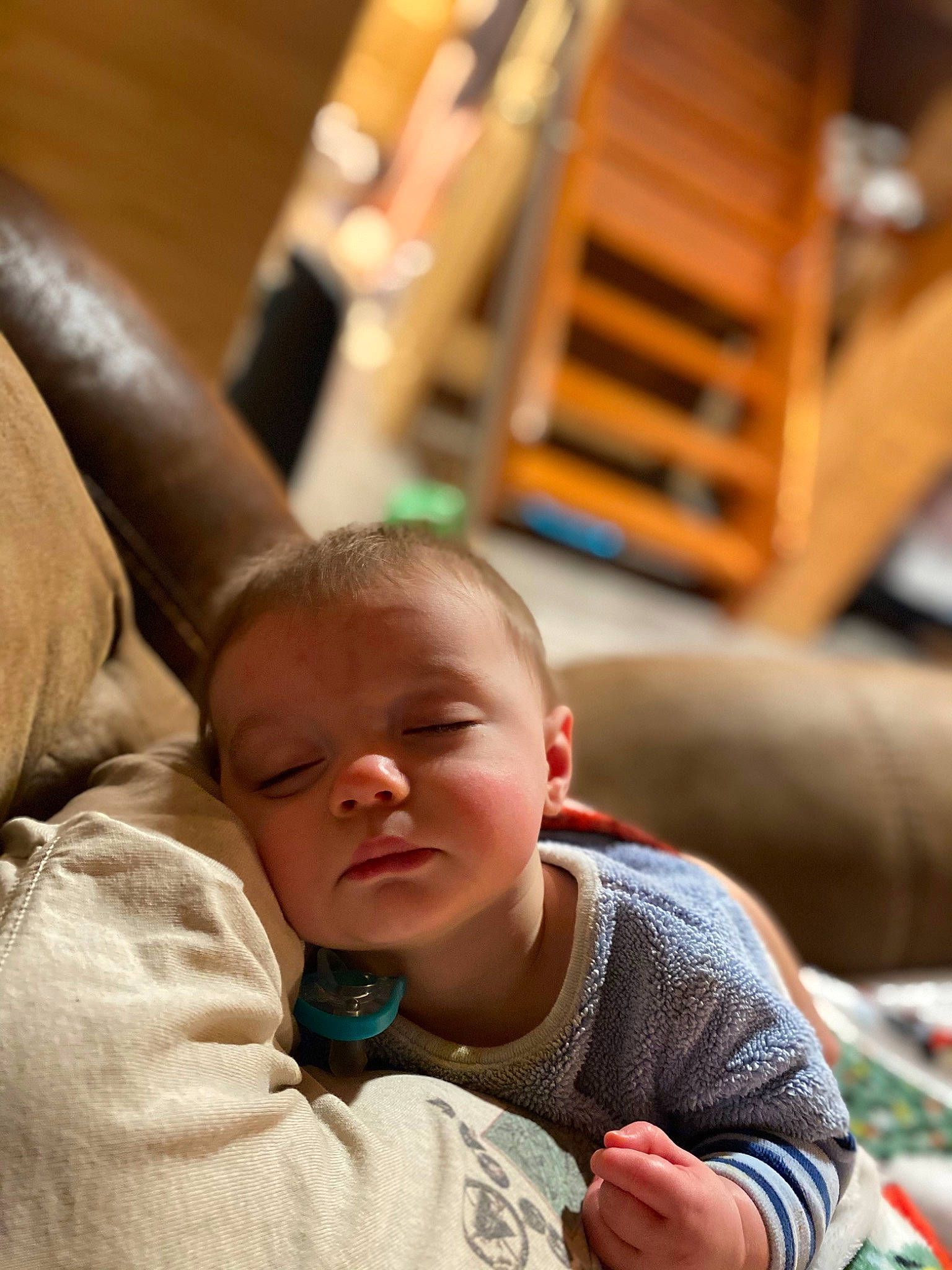 Brett is registered to the contest to win money with this photo: baby, baby_toddler_clothing, chair, cheek, child, chin, comfort, couch, face, finger, fun, hair, happy, head, human_body, leisure, person, sitting, skin, toddler