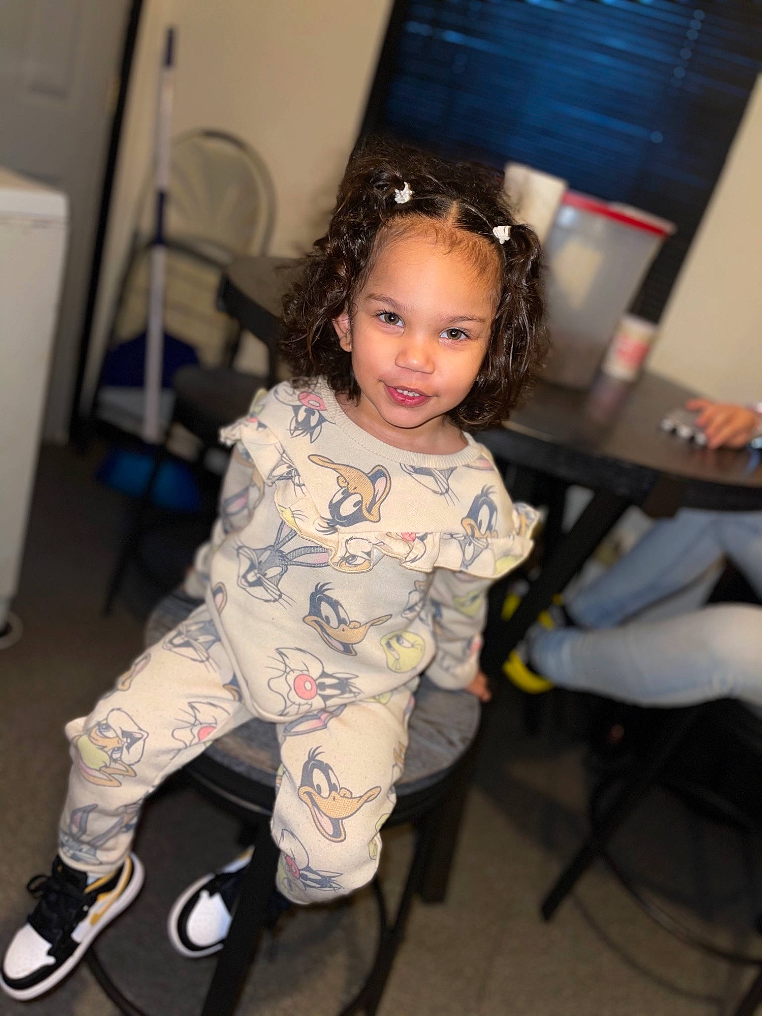 Alaiya is registered to the contest to win money with this photo: baby_toddler_clothing, black_hair, chair, child, event, fashion_design, flash_photography, floor, flooring, fun, happy, human_leg, joy, knee, person, room, sitting, smile, sneakers, standing