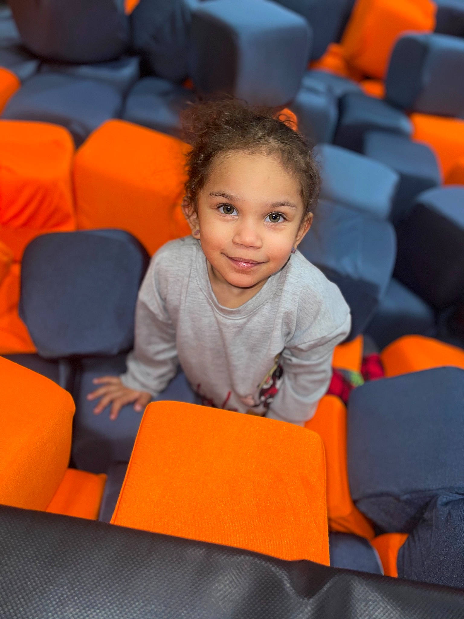 Alaiya joined the competition — help win amazing prizes! automotive_design, chair, child, clothing, comfort, electric_blue, eye, face, facial_expression, flooring, fun, hairstyle, head, human, joy, leisure, orange, person, product, sitting