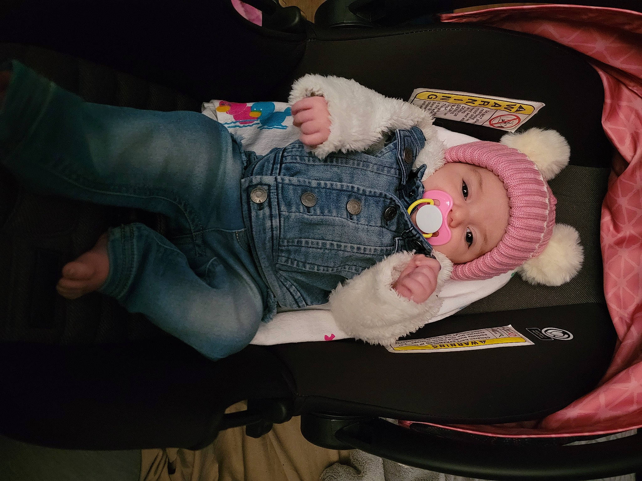 Ella is registered to the contest to win money with this photo: baby, baby_carriage, baby_products, baby_toddler_clothing, car_seat, child, comfort, denim, fur, headwear, lap, person, plush, sitting, stuffed_toy, toy