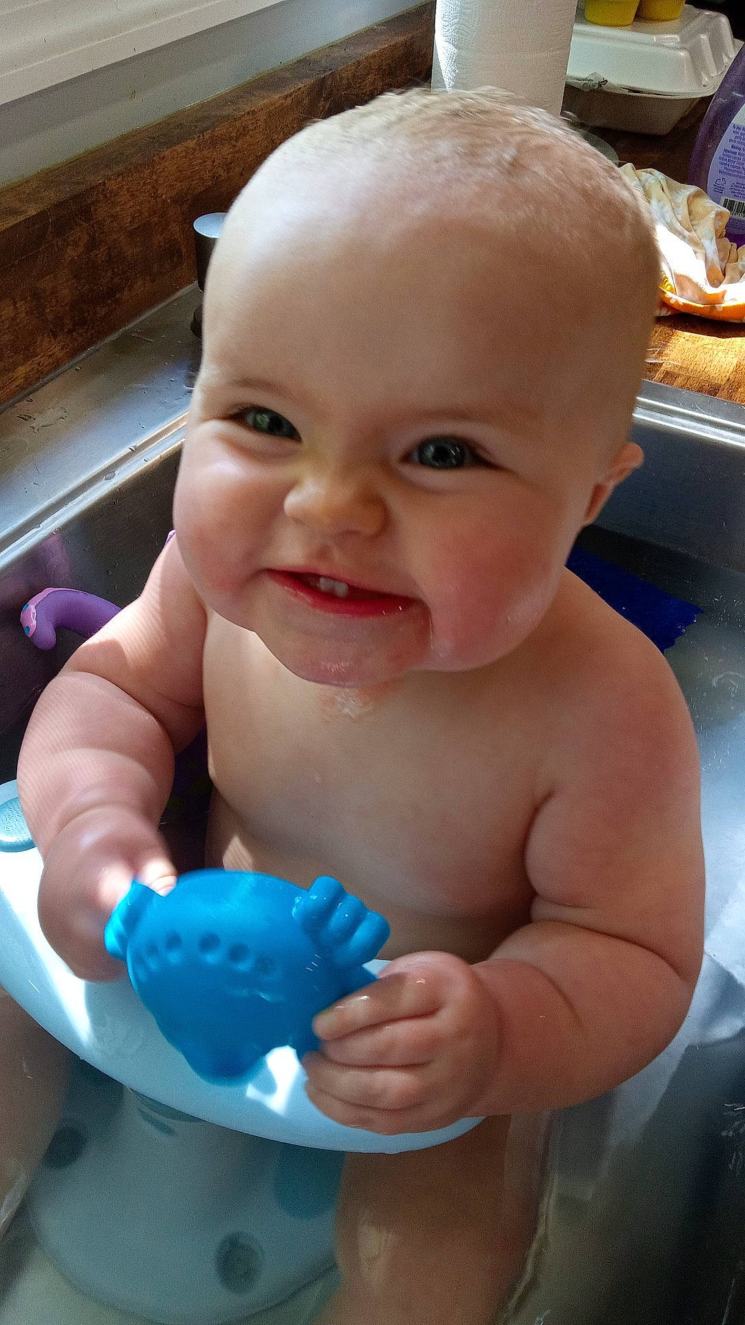 Lilah is registered to the contest to win money with this photo: baby, baby_bathing, bathing, cheek, chin, eye, finger, fun, gesture, happy, iris, joy, mouth, muscle, nose, person, product, skin, smile, thumb