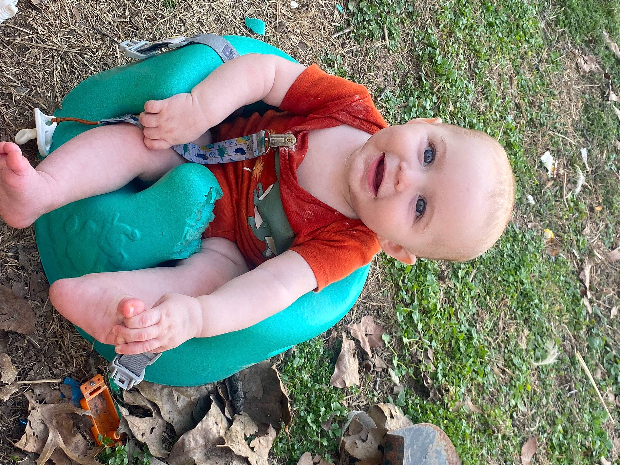 Mason is registered to the contest to win money with this photo: baby, baby_toddler_clothing, child, electric_blue, fun, grass, grass_family, grassland, happy, joy, leaf, leisure, people_in_nature, person, personal_protective_equipment, plant, play, recreation, sitting, smile