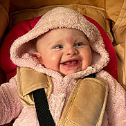 Emilia joined the competition — help win amazing prizes! baby, child, hooded_jacket, pink, car_seat, harness, smile, happy, cute, infant, face, clothing, seatbelt, straps, indoor, closeup, adorable, young, expression, warm