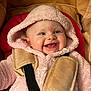 baby, child, hooded_jacket, pink, car_seat, harness, smile, happy, cute, infant, face, clothing, seatbelt, straps, indoor, closeup, adorable, young, expression, warm