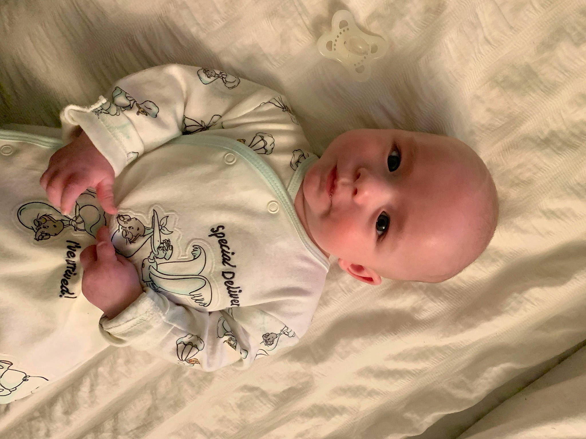 Indy is registered to the contest to win money with this photo: baby, baby_products, baby_toddler_clothing, bed, bedtime, cheek, child, comfort, face, head, linens, mammal, mouth, nose, pattern, person, skin, sleeve, textile, toddler