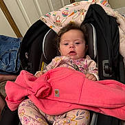 Phoebe joined the competition — help win amazing prizes! baby, bodypart, car, car_interior, carseat, clothing, couch, cushion, face, finger, furniture, hand, head, homedecor, jeans, pants, person, stroller, transportation, vehicle
