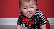 Ezekiel joined the competition — help win amazing prizes! baby, bracelet, child, crawling, cute, fashion, floor, happy, indoor, mohawk_hairstyle, person, plaid_shirt, portrait, red_background, red_bow_tie, short_sleeves, smiling, studio, wooden_floor, young_child