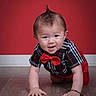 Ezekiel joined the competition — help win amazing prizes! baby, child, crawling, red_bow_tie, plaid_shirt, mohawk_hairstyle, floor, indoor, portrait, cute, smiling, happy, person, young_child, fashion, red_background, wooden_floor, bracelet, short_sleeves, studio