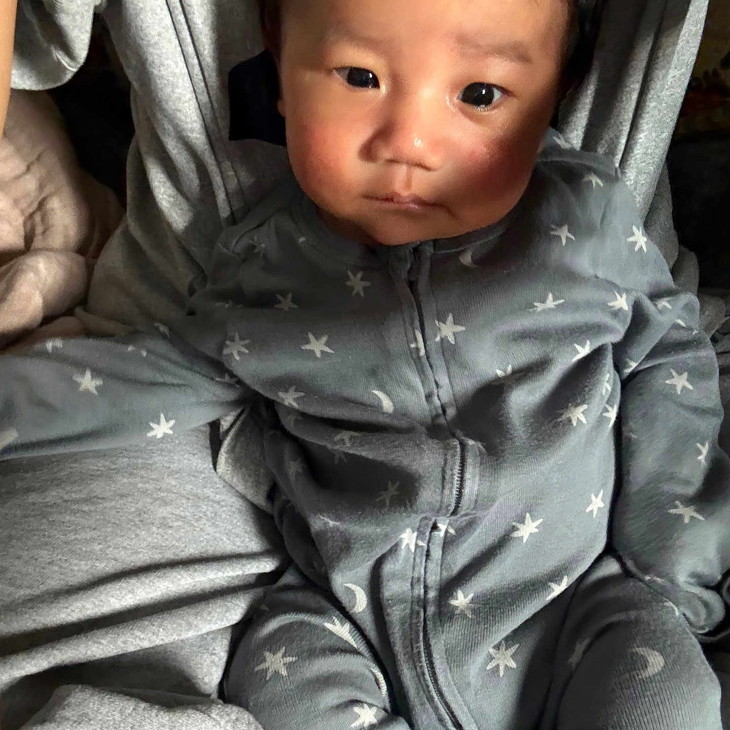 Mung joined the competition — help win amazing prizes! baby, child, infant, pajamas, stars, face, person, clothing, sitting, hands, legs, cute, indoor, soft_light, expression, portrait, cozy, fabric, skin, young