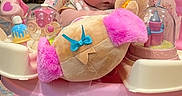 Genevieve is registered to the contest to win money with this photo: baby, child, pink, toy, plush, activity_center, indoor, carpet, feet, serious_expression, face, person, playtime, furniture, home, floor, cute, infant, legs, colorful