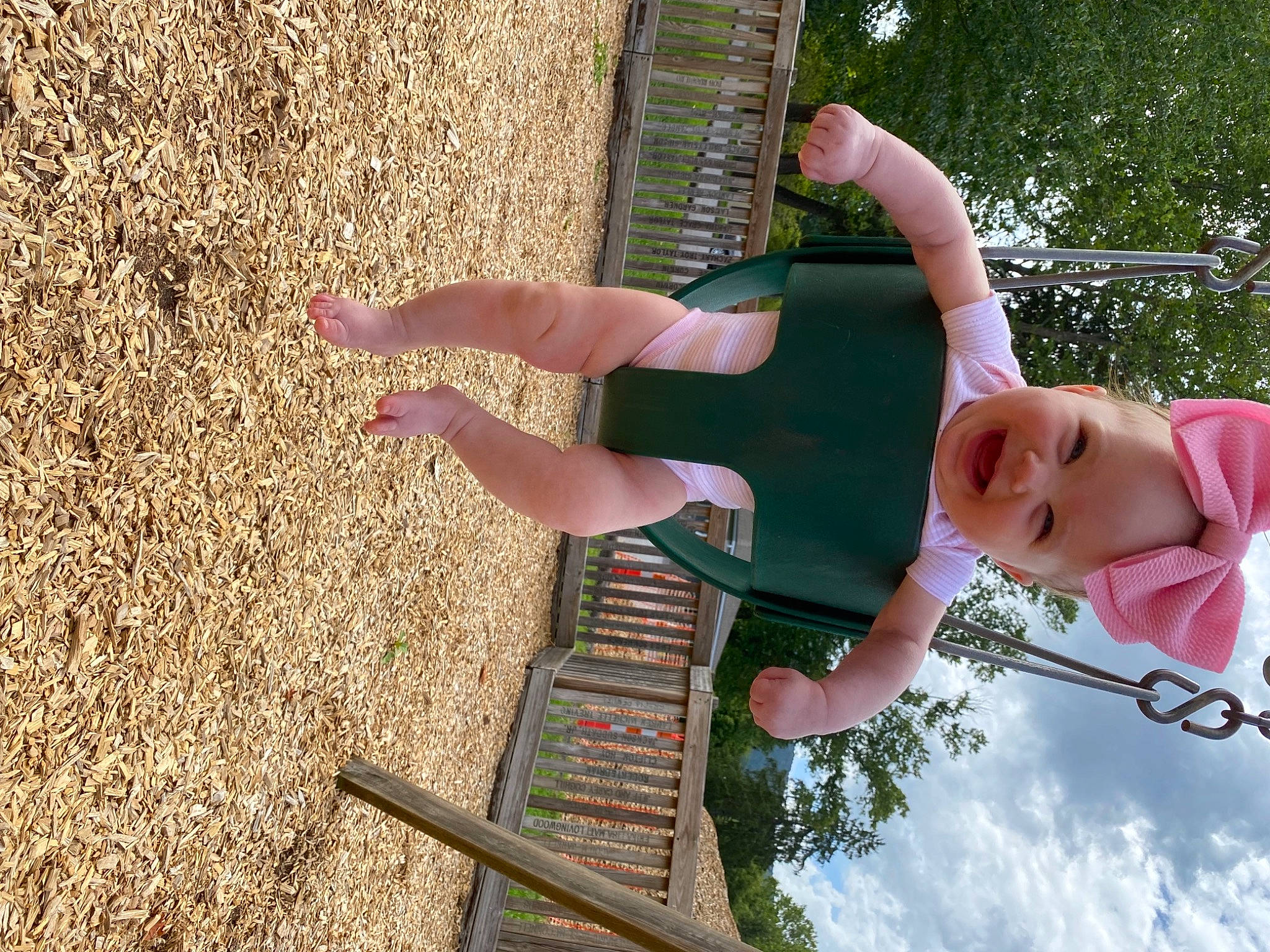 Ivy is registered to the contest to win money with this photo: calf, cloud, elbow, fun, grass, headwear, human_leg, leisure, people_in_nature, person, plant, shadow, smile, soil, thigh, toddler, tree