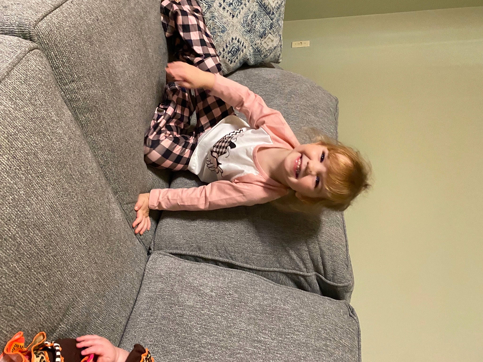 Audrey joined the competition — help win amazing prizes! comfort, couch, elbow, finger, floor, flooring, foot, grey, hardwood, human_leg, joint, joy, knee, linens, pattern, person, room, sitting, textile, thigh