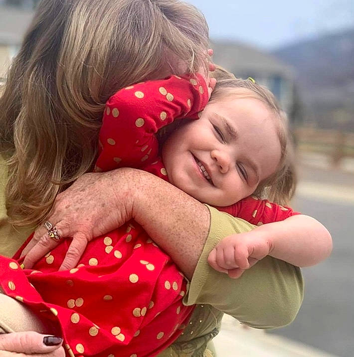 Audrey is registered to the contest to win money with this photo: baby_toddler_clothing, beauty, blond, child, facial_expression, fun, gesture, grass, hair, happy, hug, joy, love, nail, pattern, people_in_nature, person, skin, sleeve, smile