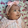 adorable, baby, blanket, bow, child, closeup, cute, expression, face, floral, headband, indoors, infant, knitwear, newborn, pink, portrait, skin, sleepwear, soft