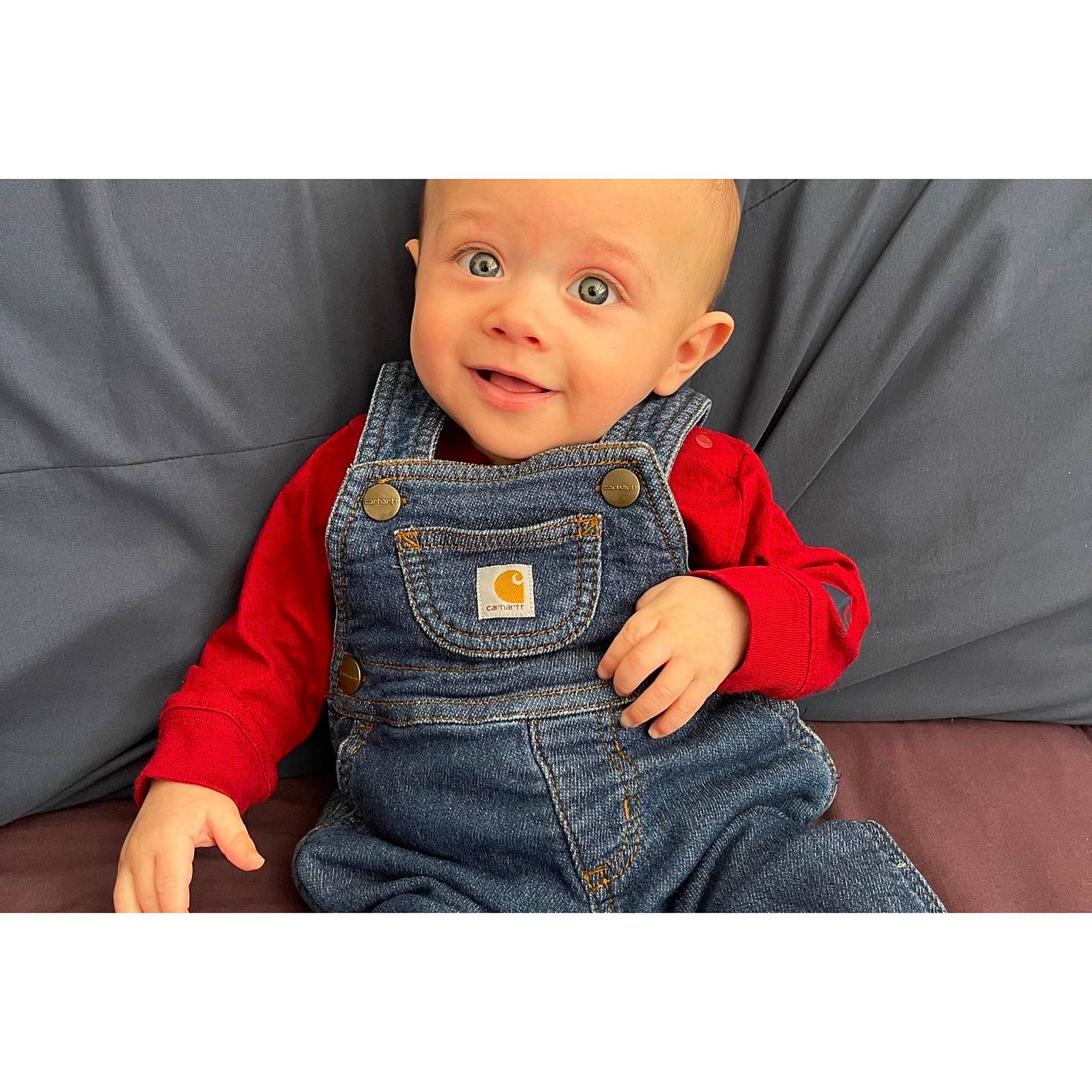 Luka is registered to the contest to win money with this photo: baby, baby_toddler_clothing, beauty, collar, comfort, denim, dress, electric_blue, face, happy, head, human_body, outerwear, pattern, person, sitting, sleeve, smile, t_shirt, textile