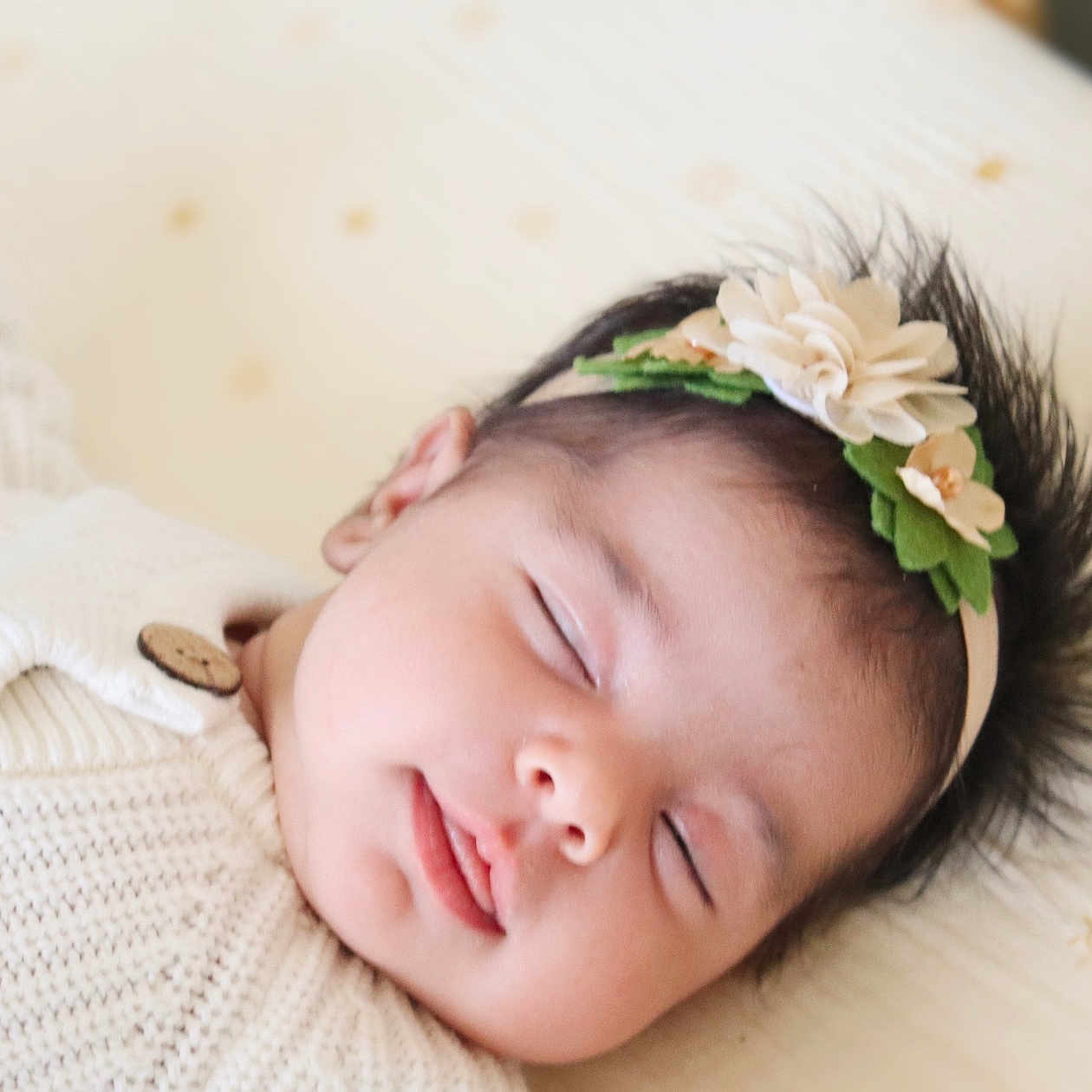 Willow is registered to the contest to win money with this photo: accessories, baby, face, happy, head, headband, newborn, person, photography, portrait, sleeping, smile