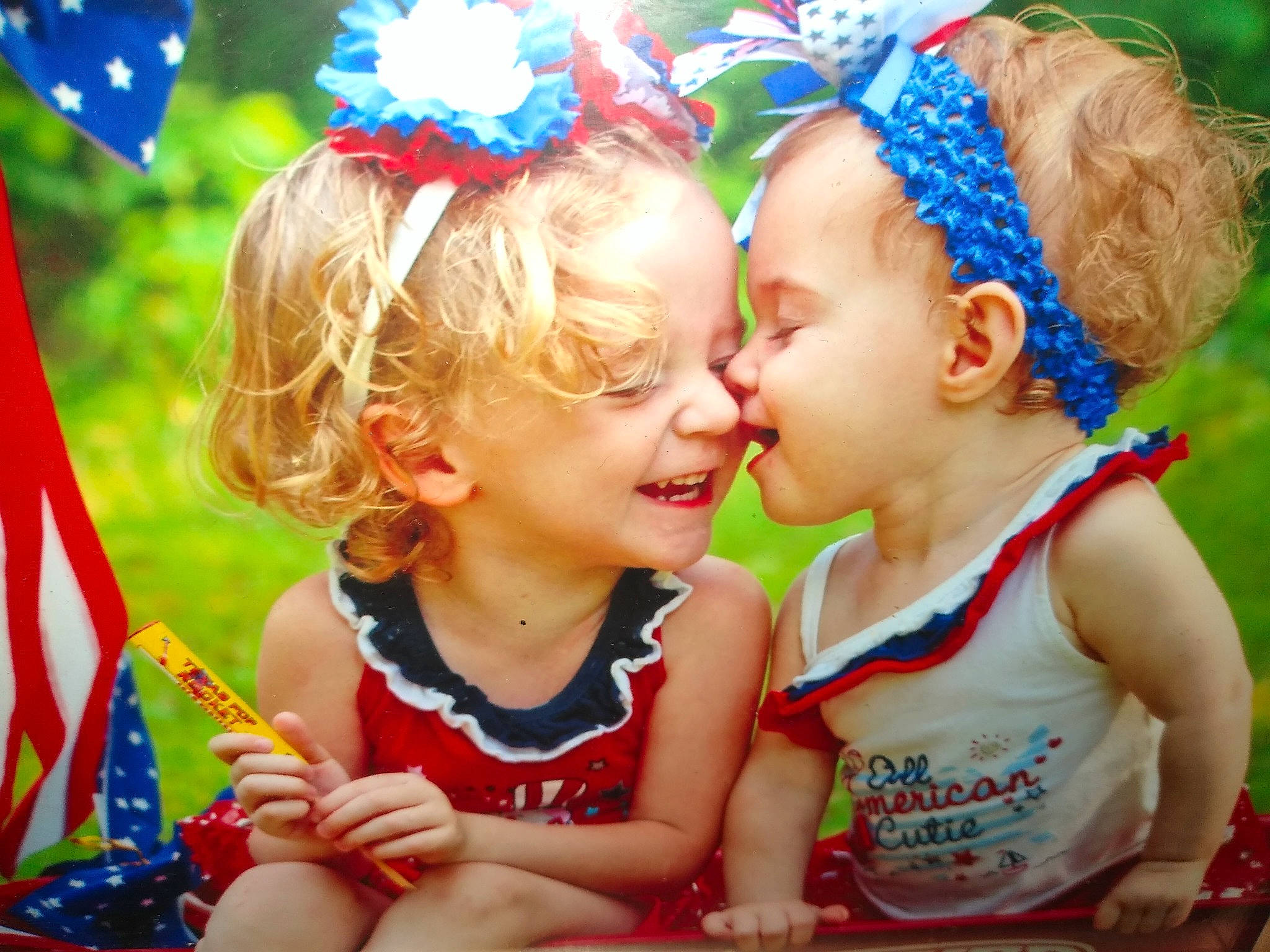 Kilea is registered to the contest to win money with this photo: adaptation, baby, baby_toddler_clothing, blue, child, facial_expression, fun, grass, happy, iris, leisure, people, people_in_nature, person, photograph, plant, smile, snapshot, summer, toddler