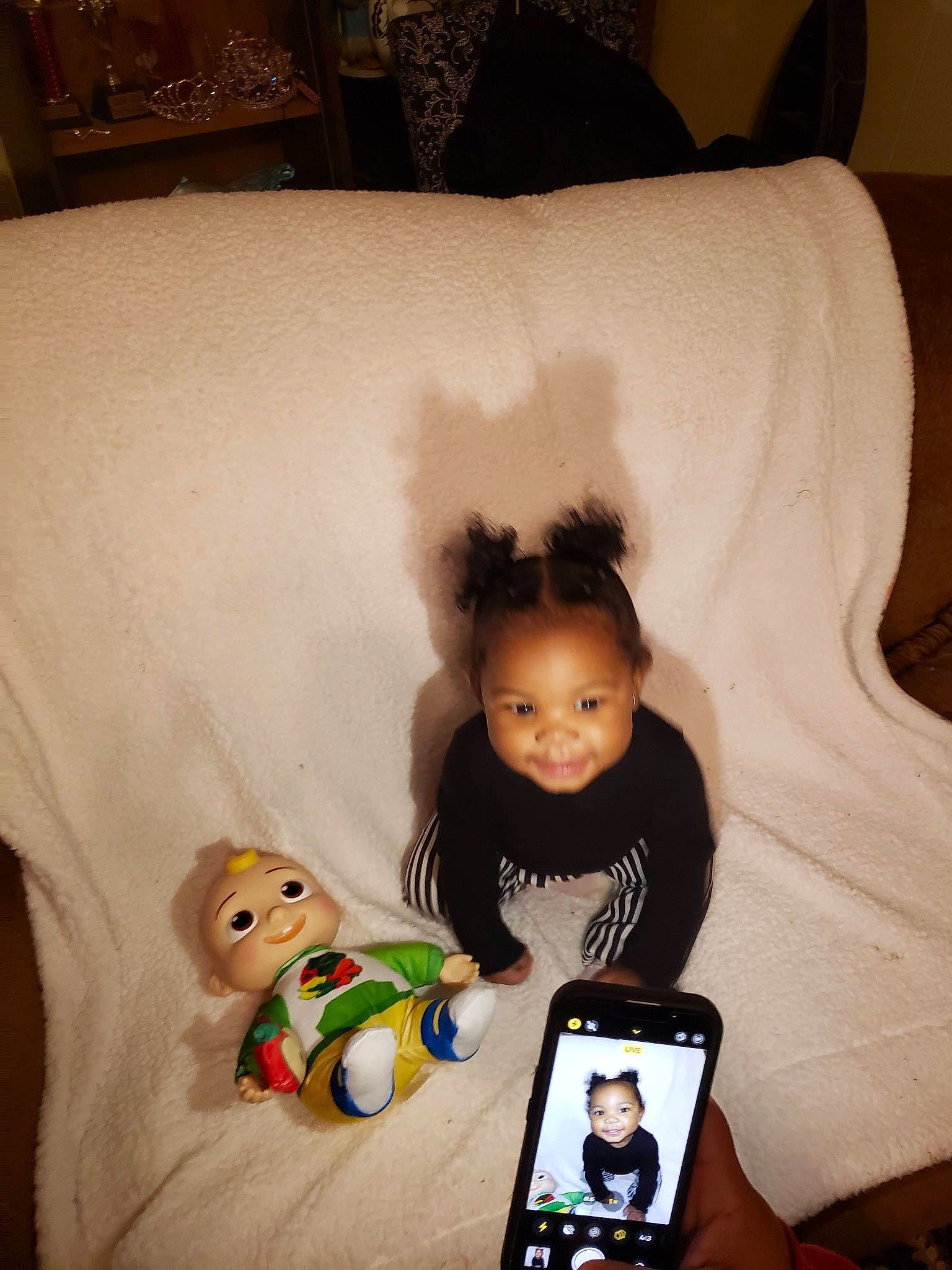 Brinleigh is registered to the contest to win money with this photo: baby, baby_toddler_clothing, cheek, child, comfort, face, flooring, happy, head, joy, linens, person, room, sitting, skin, sleeve, smile, standing, t_shirt, textile