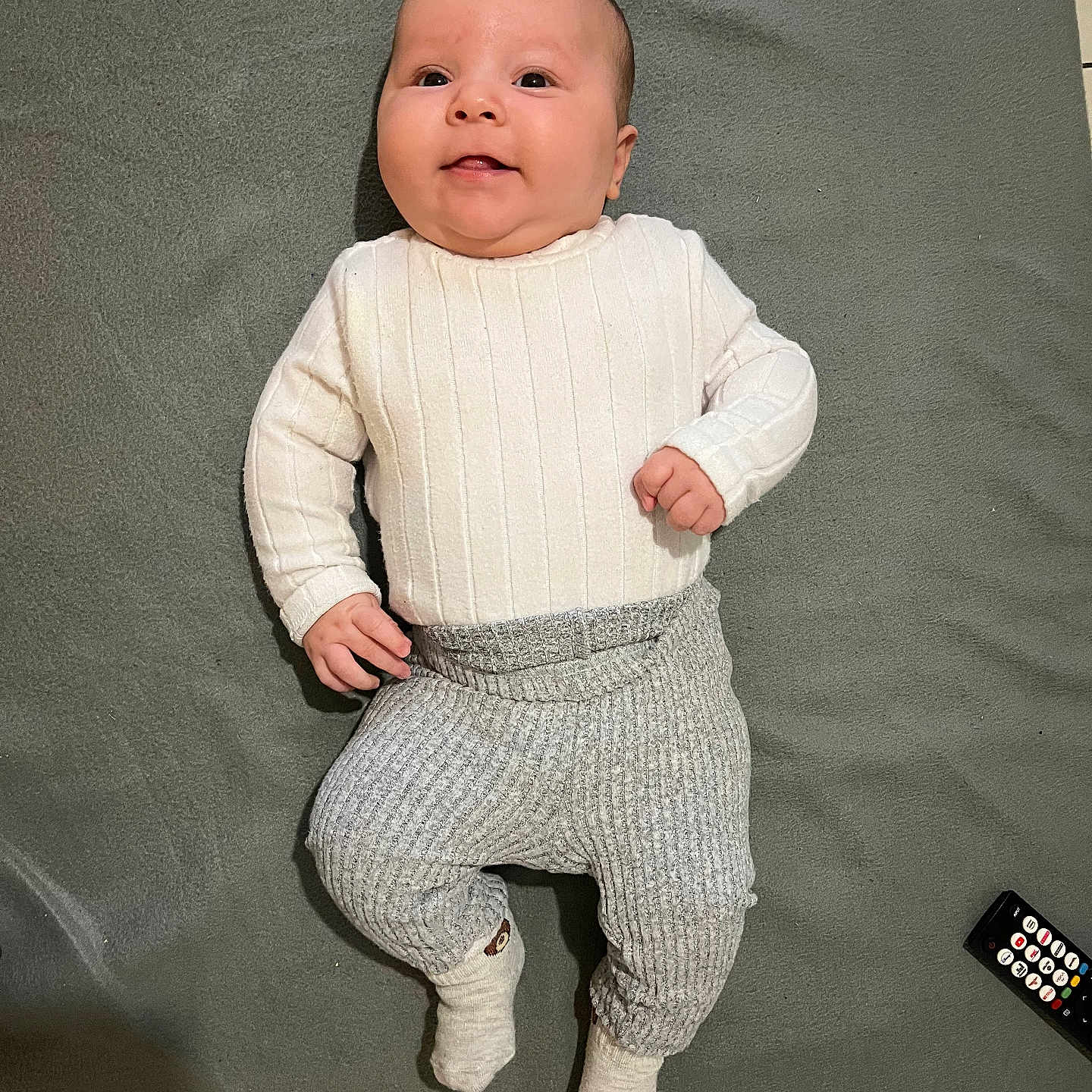 Nael participe au concours pour gagner de l'argent avec cette photo : baby, bodypart, clothing, face, finger, formalwear, hand, happy, head, hosiery, knitwear, longsleeve, pants, person, photography, portrait, sleeve, sock, suit, sweater
