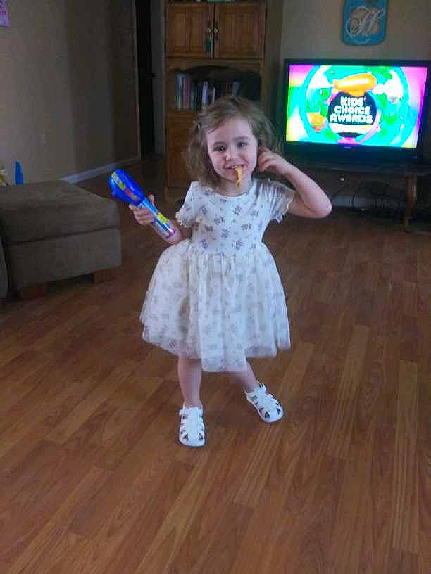 Dixie joined the competition — help win amazing prizes! child, couch, dress, entertainment, event, floor, flooring, fun, hardwood, human_leg, joy, laminate_flooring, leg, person, smile, television, television_set, toddler, varnish, wood