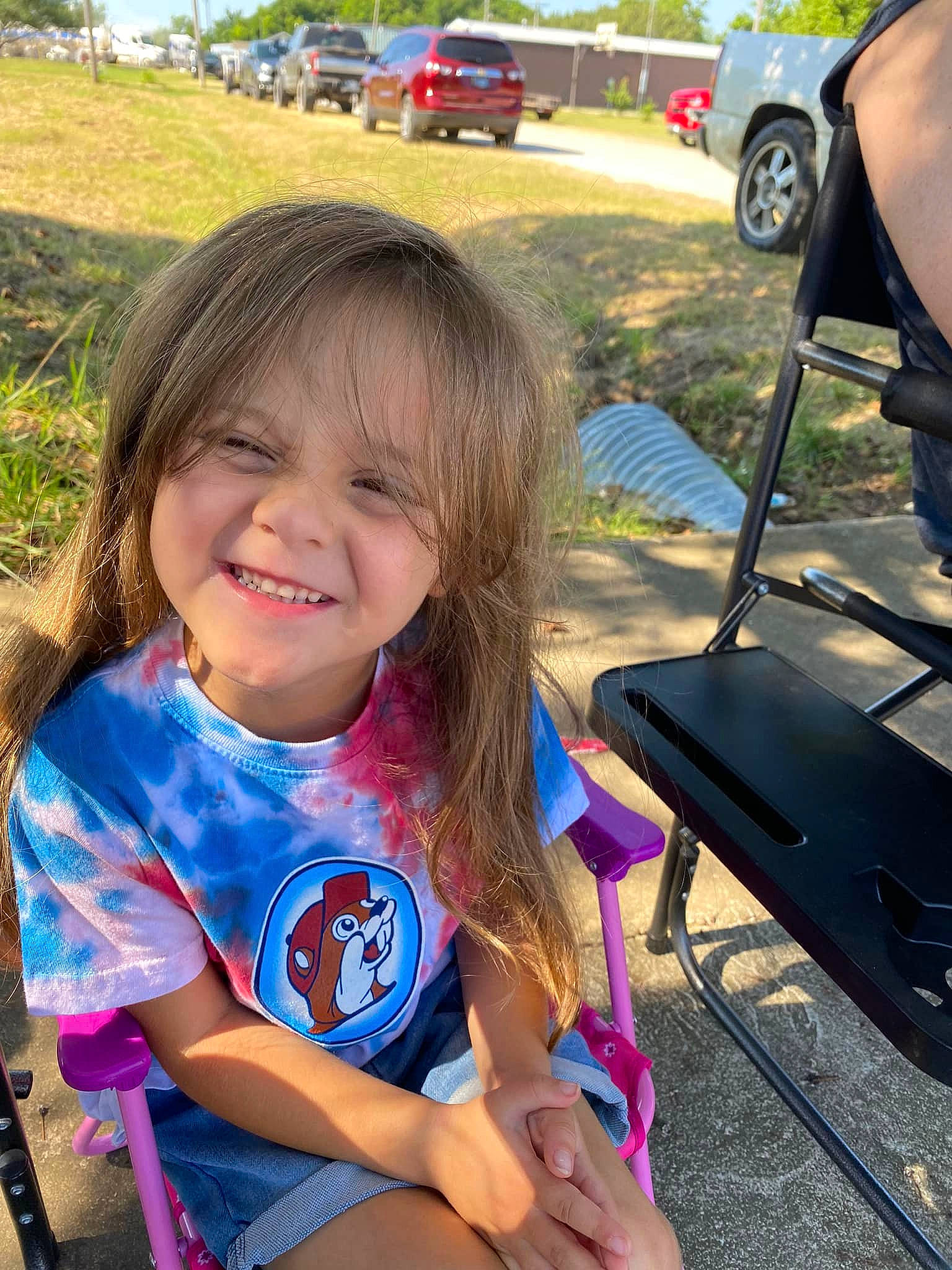 Holly is registered to the contest to win money with this photo: car, electric_blue, fun, grass, happy, joy, leisure, morning, outdoor_recreation, people, person, plant, public_space, recreation, smile, summer, toddler, travel, tree, truck