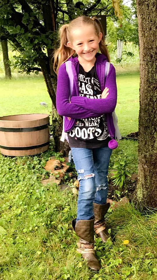 Taigan is registered to the contest to win money with this photo: boot, child, child_model, clothing, denim, footwear, grass, jacket, jeans, joy, leggings, outerwear, person, plant, play, sleeve, t_shirt, toddler, trousers