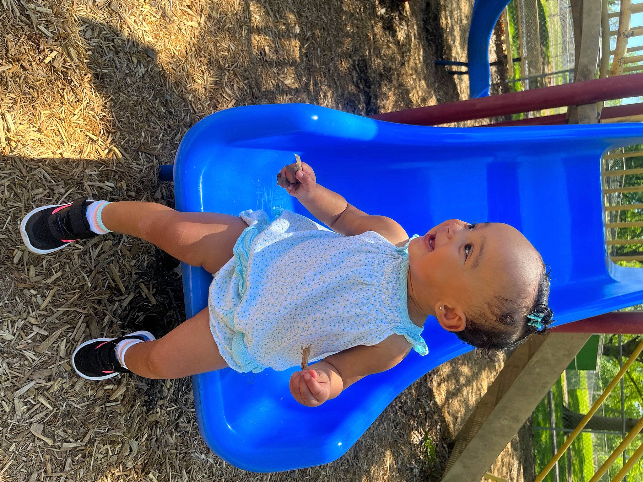 Tinsley is registered to the contest to win money with this photo: azure, baby_toddler_clothing, blue, child, chute, city, electric_blue, fun, grass, happy, leisure, outdoor_play_equipment, person, plant, playground, recreation, summer, thigh, toddler, tree