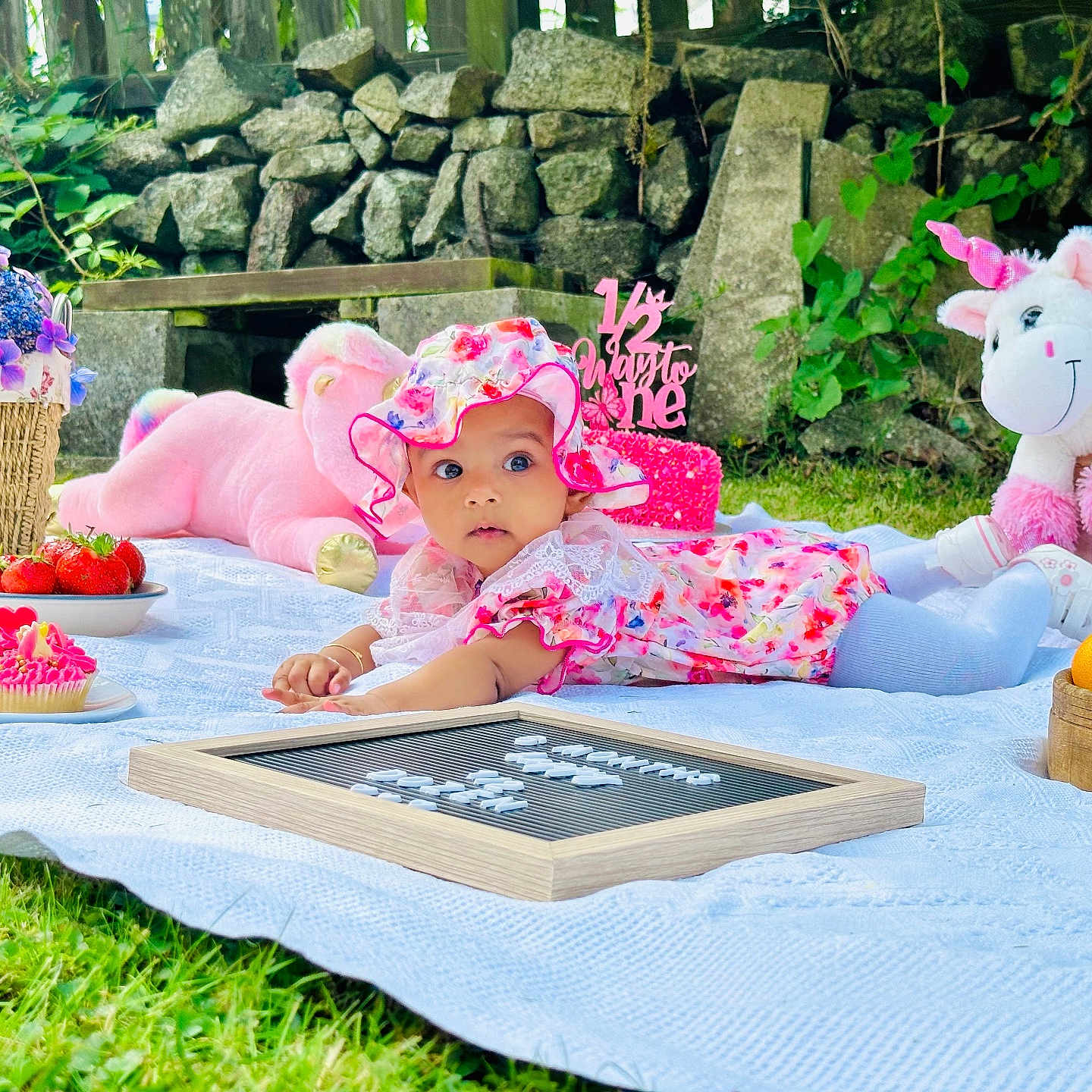Diveinya joined the competition — help win amazing prizes! baby, basket, blanket, child, cupcakes, cute, floral_dress, floral_hat, garden, grass, greenery, oranges, outdoor, picnic, pink_teddy_bear, stone_wall, strawberries, stuffed_animals, toy, unicorn